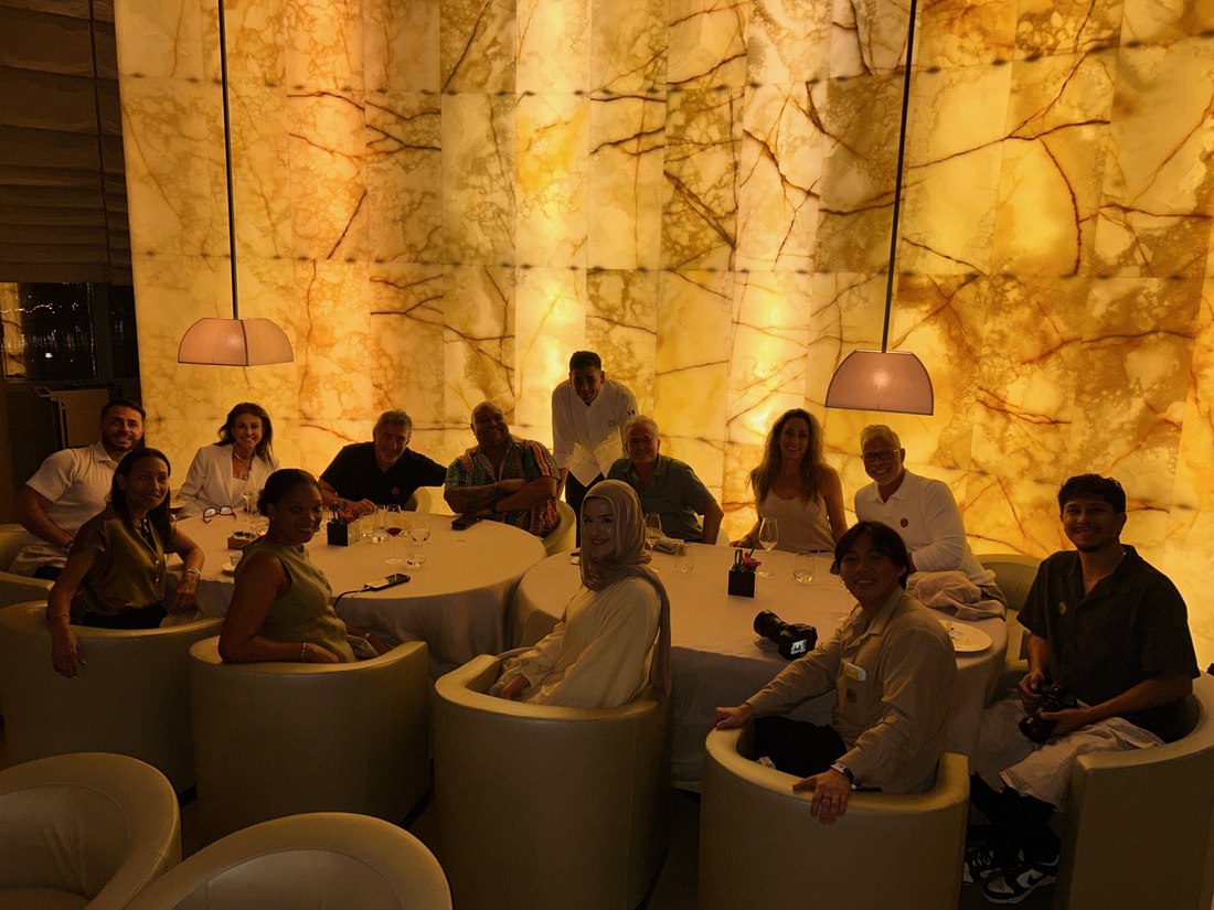 Private dining room with a glowing onyx wall
