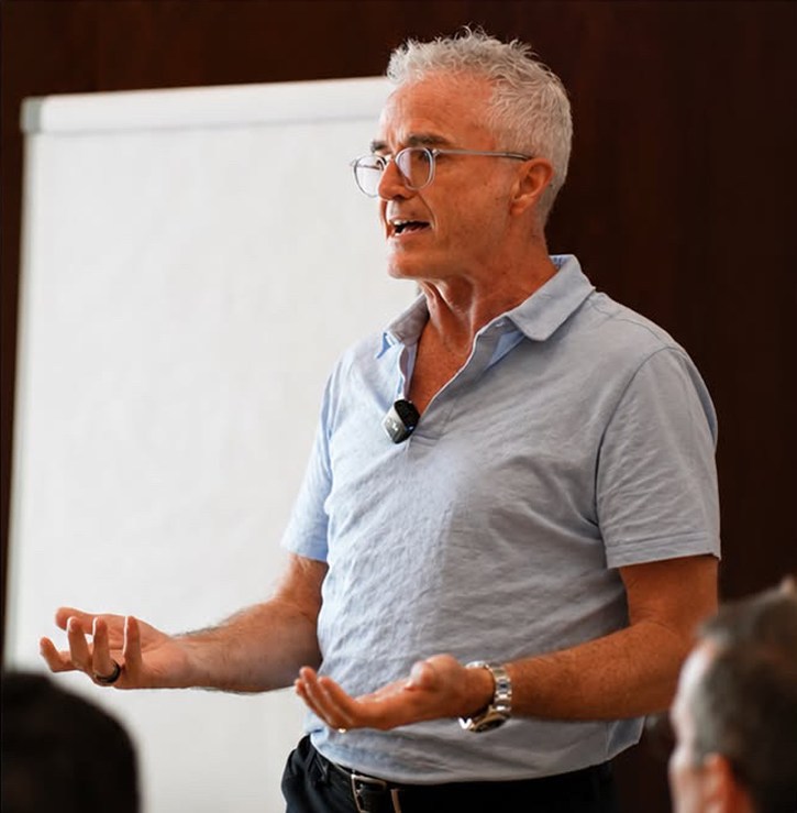 Dr. Jim Arnold leading a discussion at a flip chart